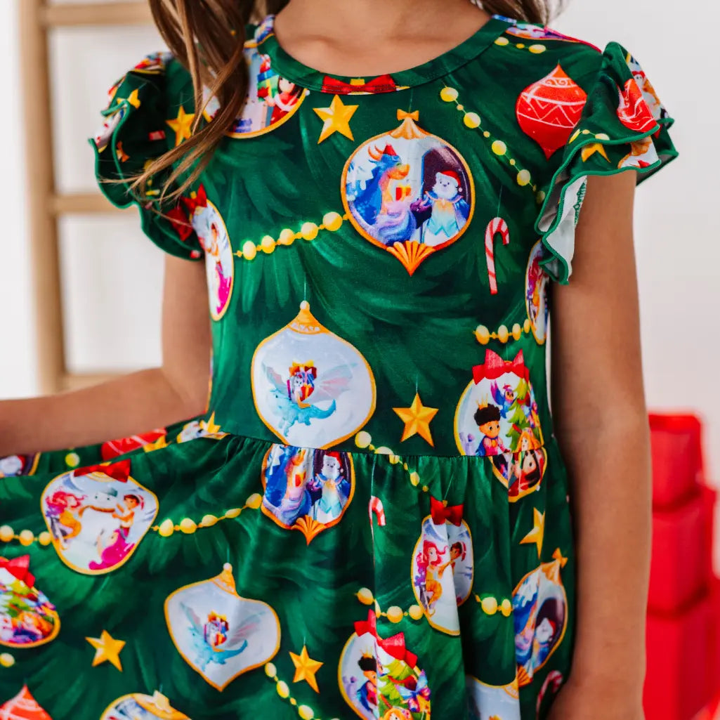 Green dress with festive character prints and decorations on a blurred background